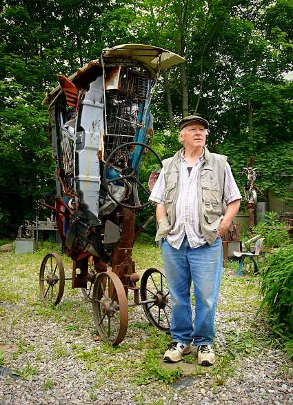 Norman Tinker with his sculpure